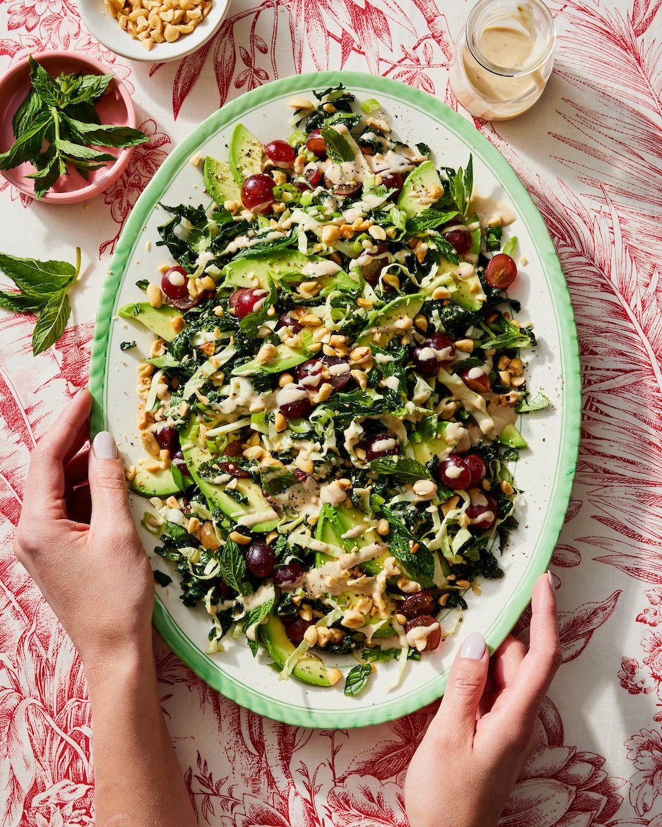 avocado kale grape salad on a platter