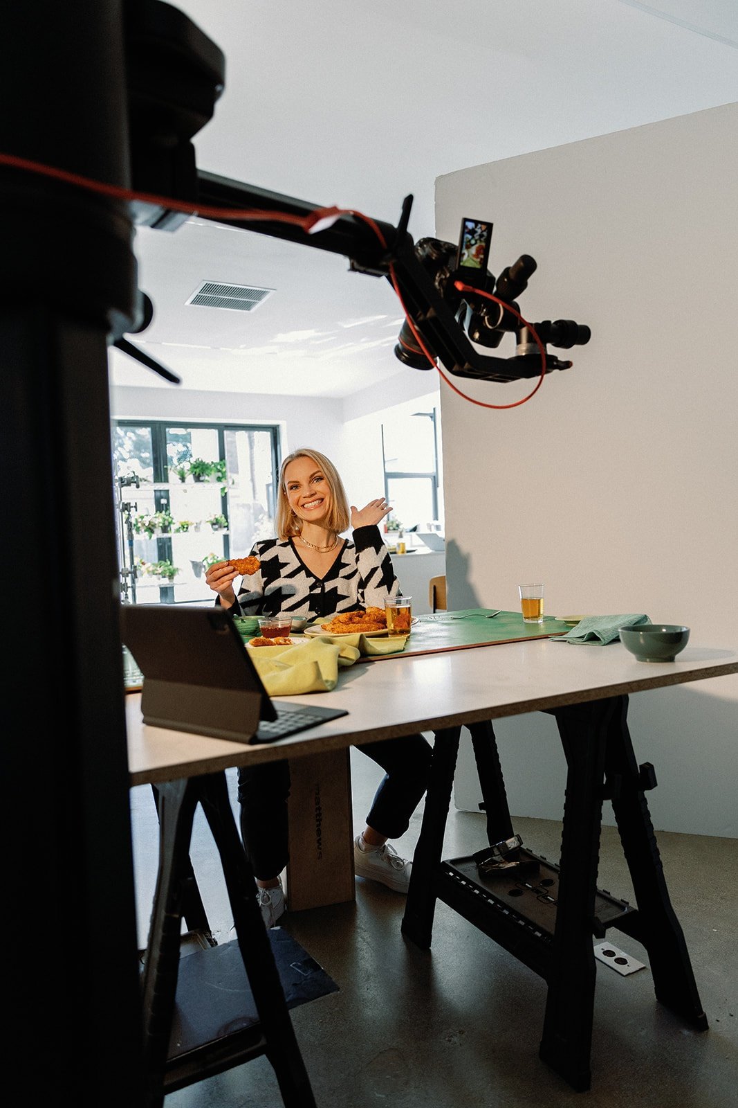 Monique Volz of Ambitious Kitchen at a table with a camera overhead