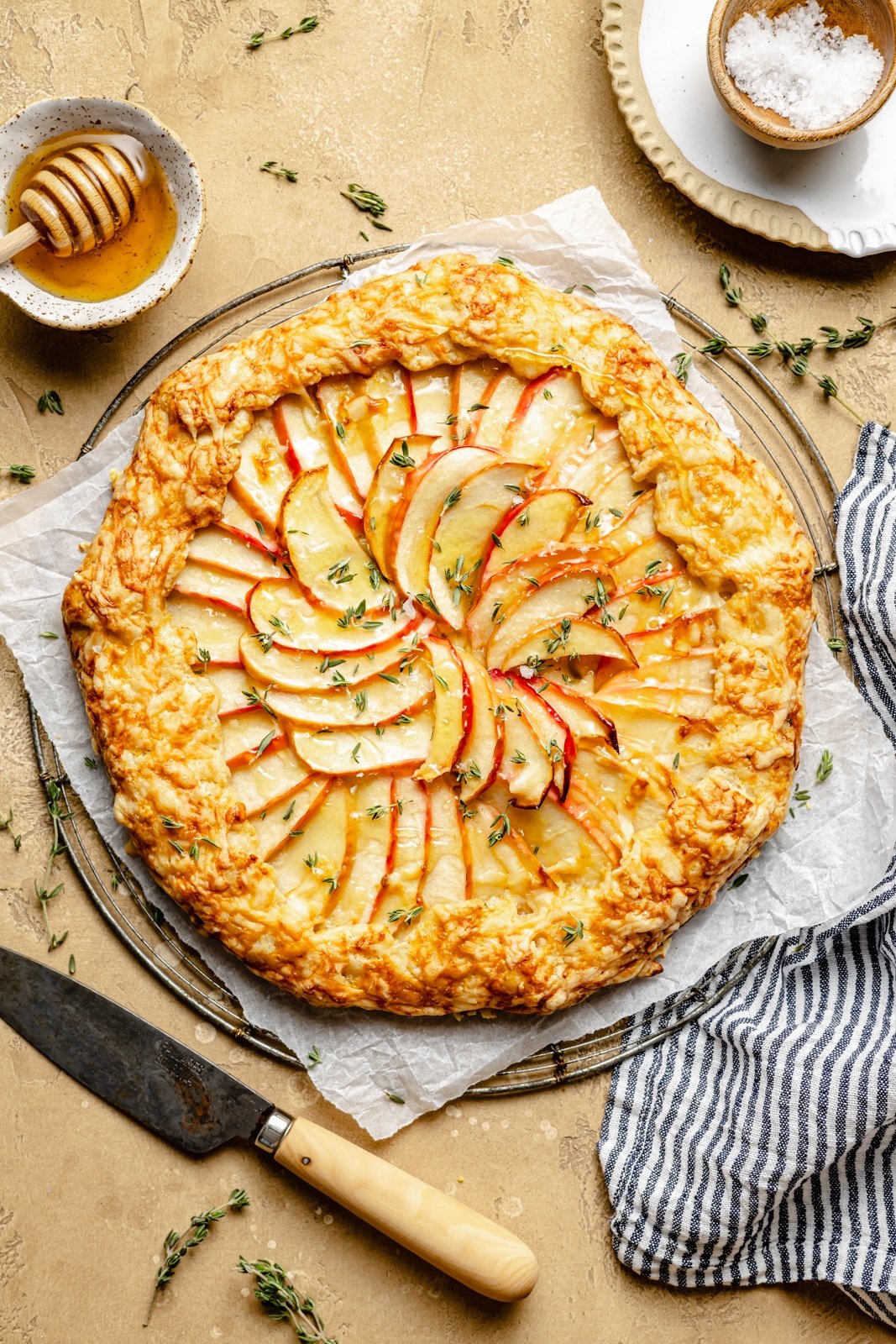 easy apple galette with cheddar cheese on a wire rack