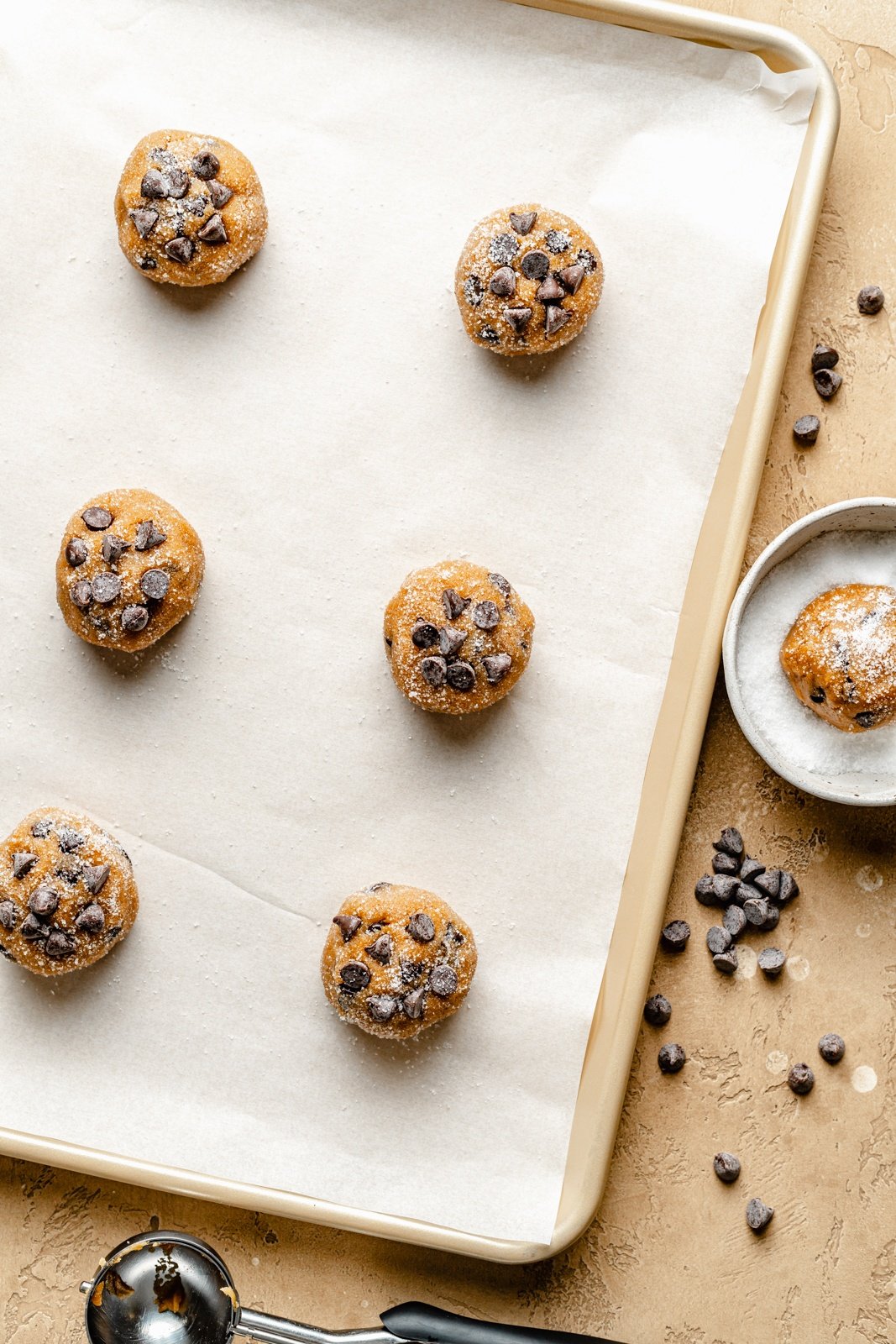 unbaked peanut butter chocolate chip cookies on a baking sheet