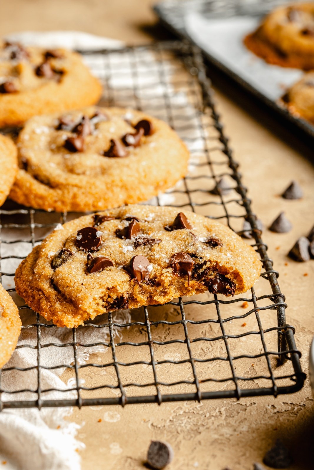 chewy peanut butter cookie on a wire rack with a bite taken out