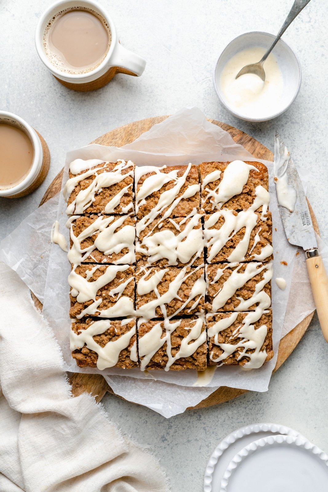 apple coffee cake cut on parchment paper