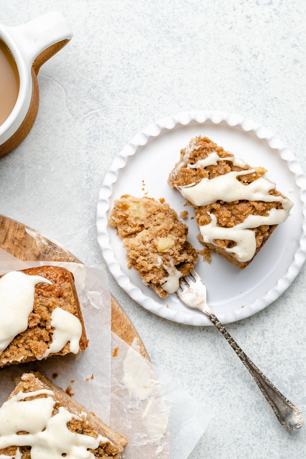 slice of brown butter apple coffee cake on a plate with a fork