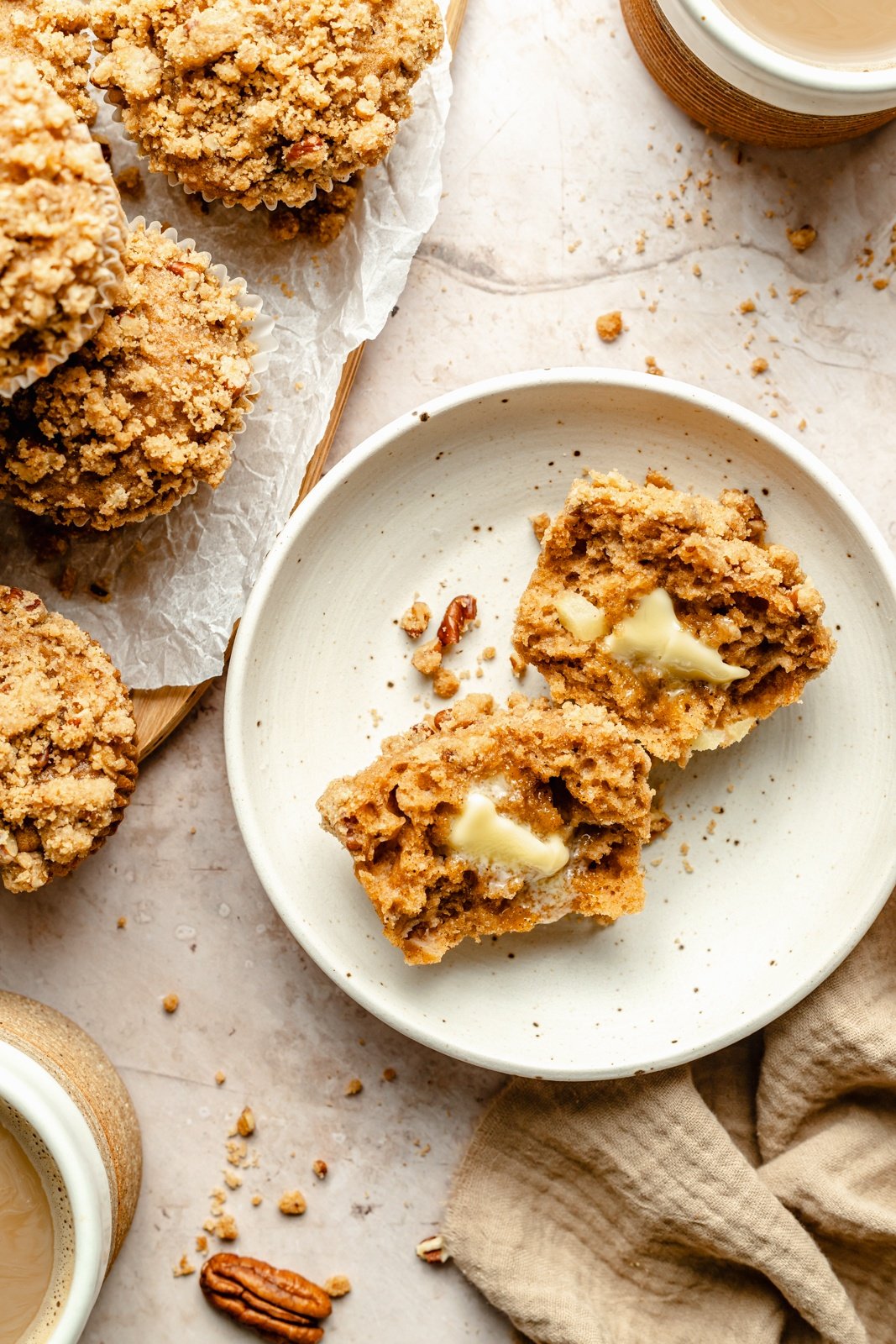 homemade apple muffin on a plate with butter