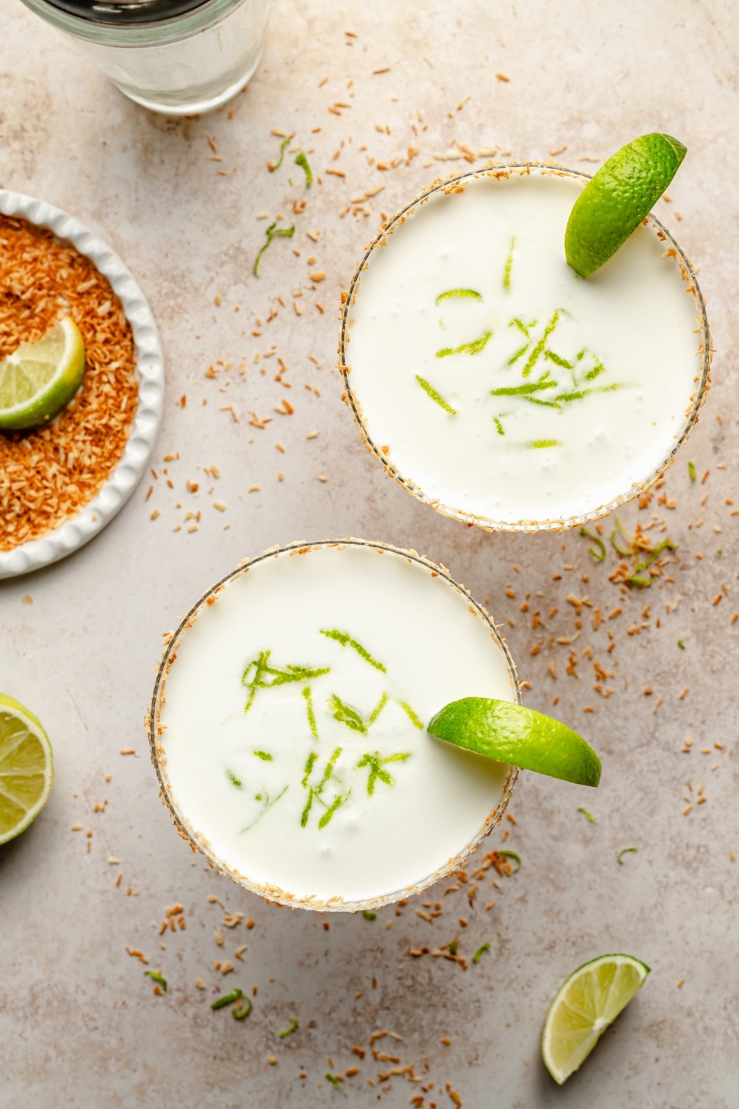 top-down view of two coconut lime margaritas