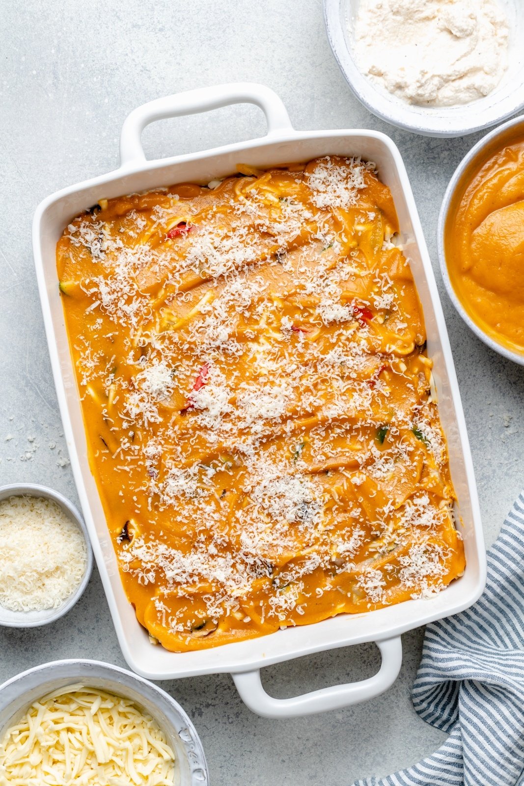 layering a roasted vegetable lasagna with butternut squash