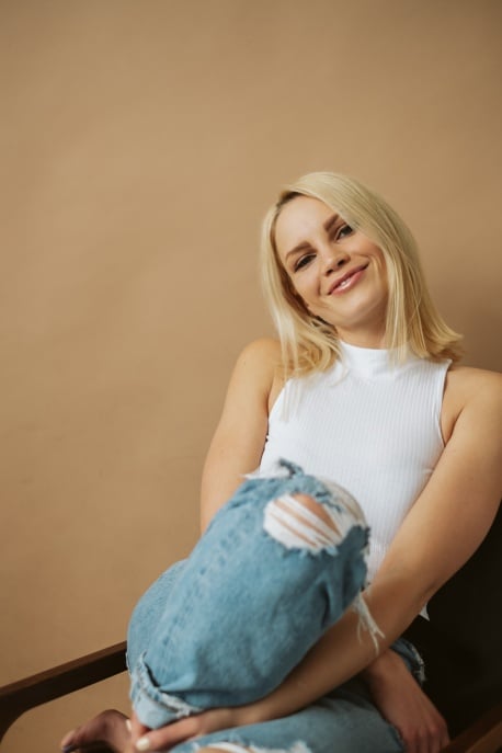 monique volz sitting in a chair