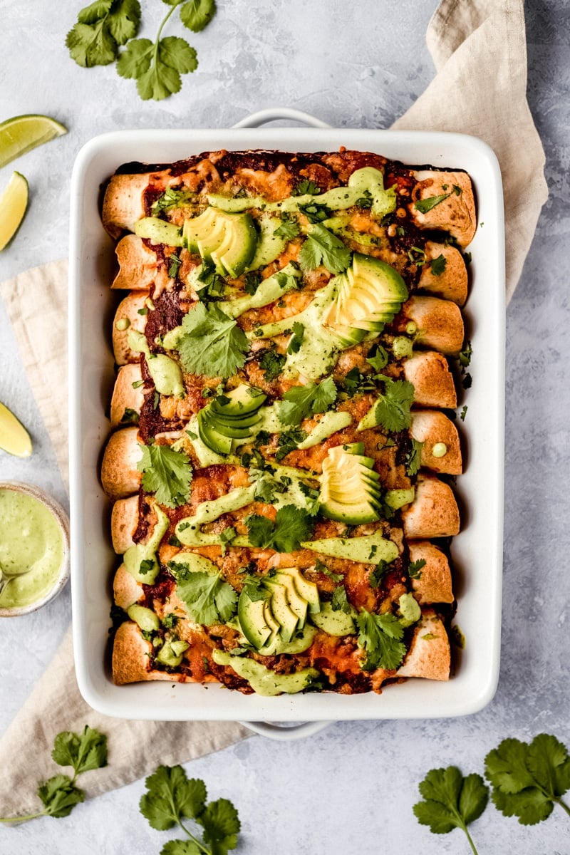 vegetarian sweet potato black bean enchiladas in a pan