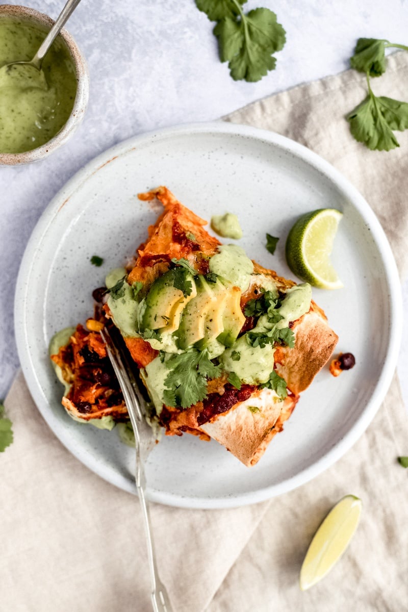 vegetarian enchiladas with sweet potato and black beans on a plate