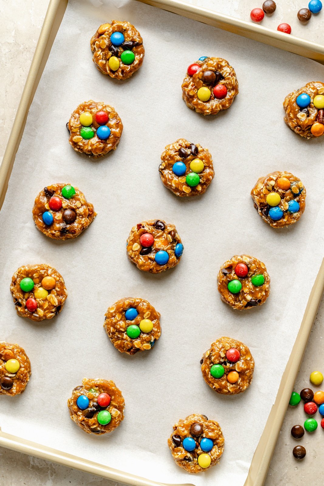 unbaked healthy monster cookies on a baking sheet