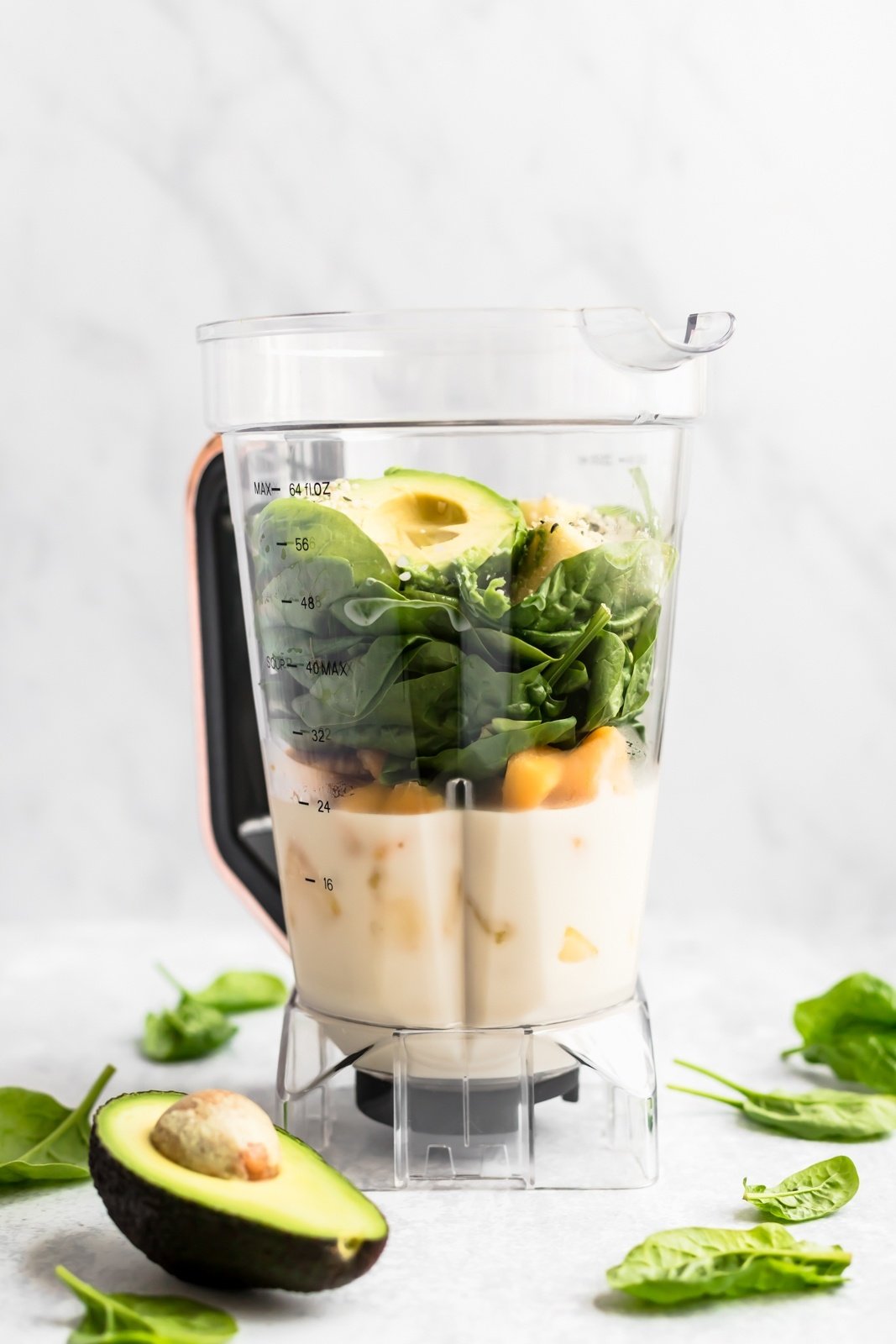 blending simple green smoothie ingredients in a blender