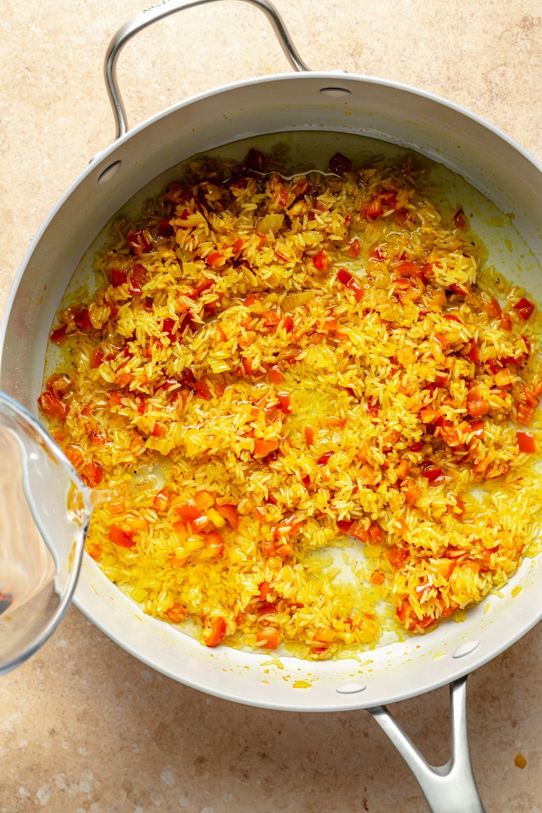 cooking vegetables to make garlic turmeric rice