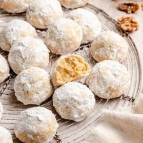 grain free snowball cookies on a wire rack