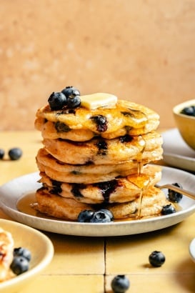 buttermilk blueberry pancakes in a stack on a plate