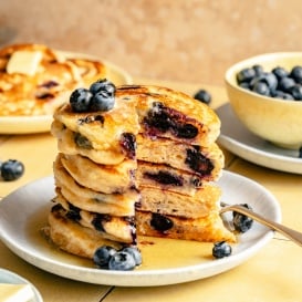 stack of buttermilk blueberry pancakes on a plate