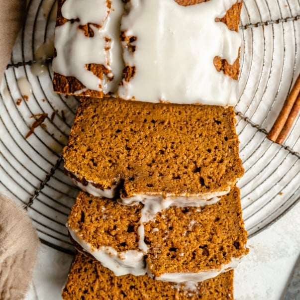 healthy pumpkin bread sliced on a wire rack