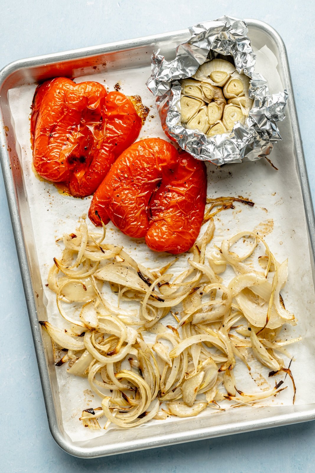 roasted vegetables on a sheet pan to make sauce for spaghetti-os