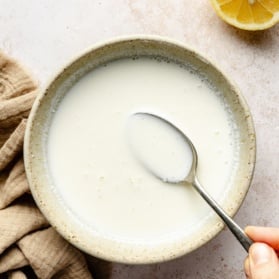 homemade buttermilk in a bowl with a spoon