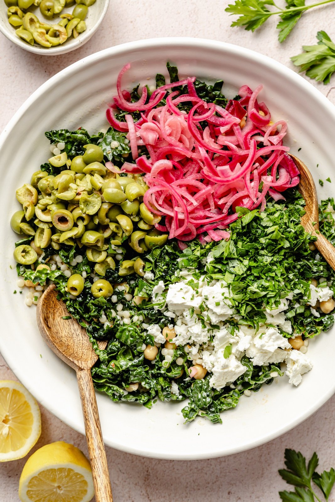 ingredients for a kale couscous salad in a bowl