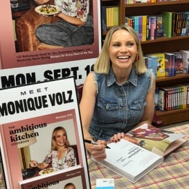 Monique Volz signing The Ambitious Kitchen Cookbook