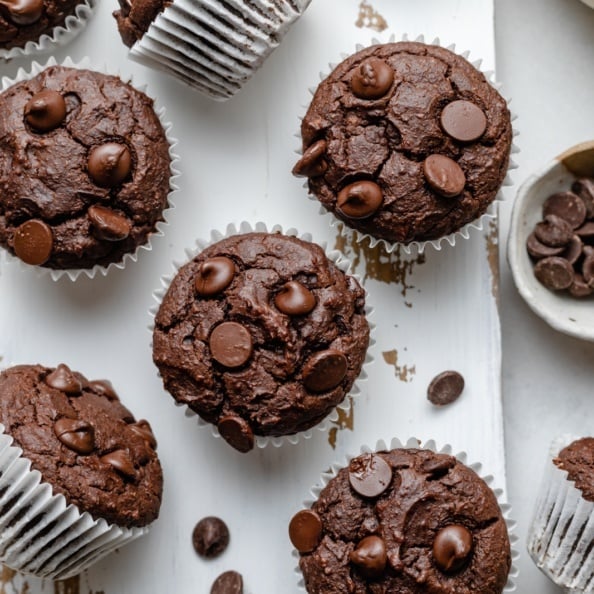 healthy almond butter chocolate pumpkin muffins on a marble board