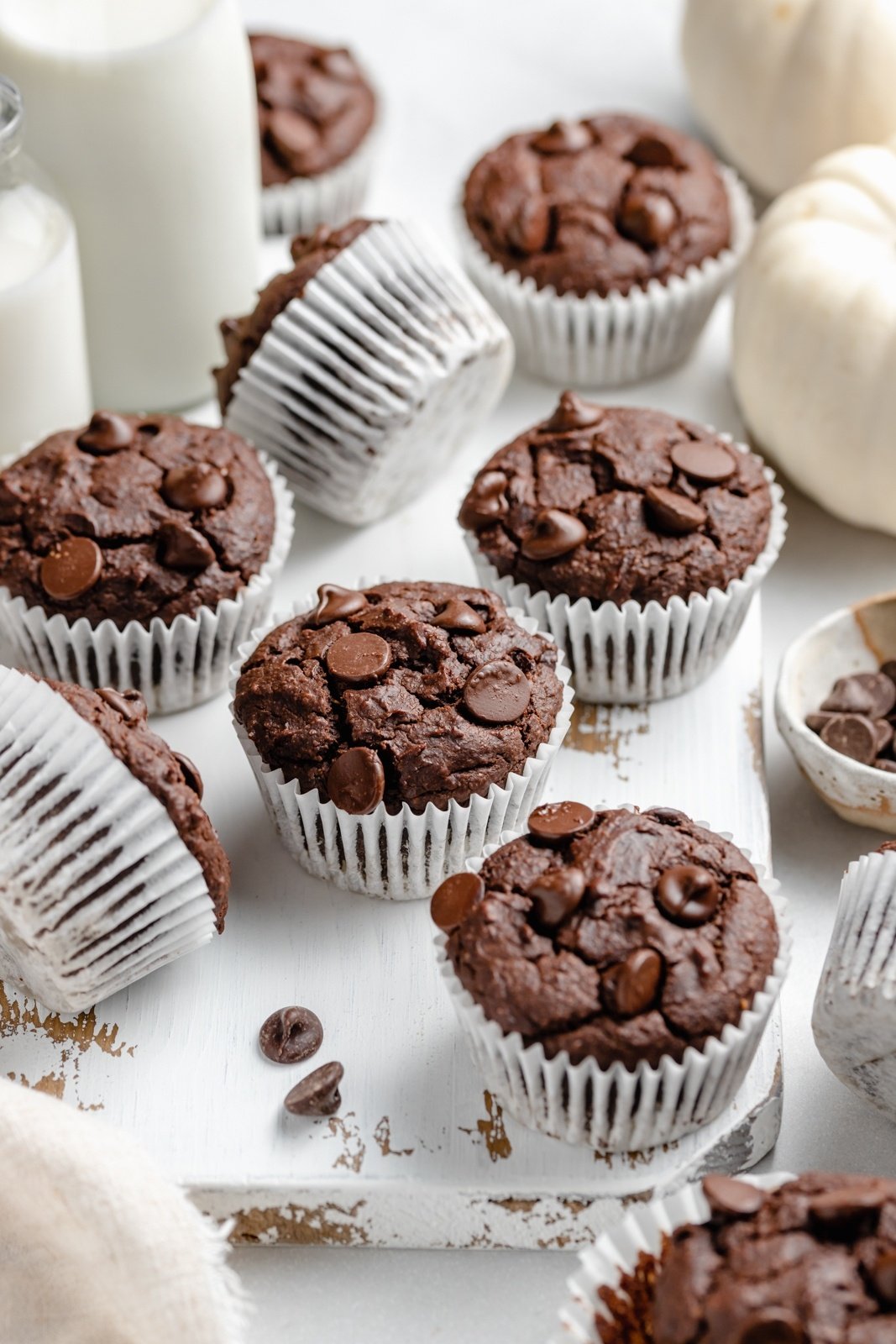 healthy chocolate pumpkin muffins on a board