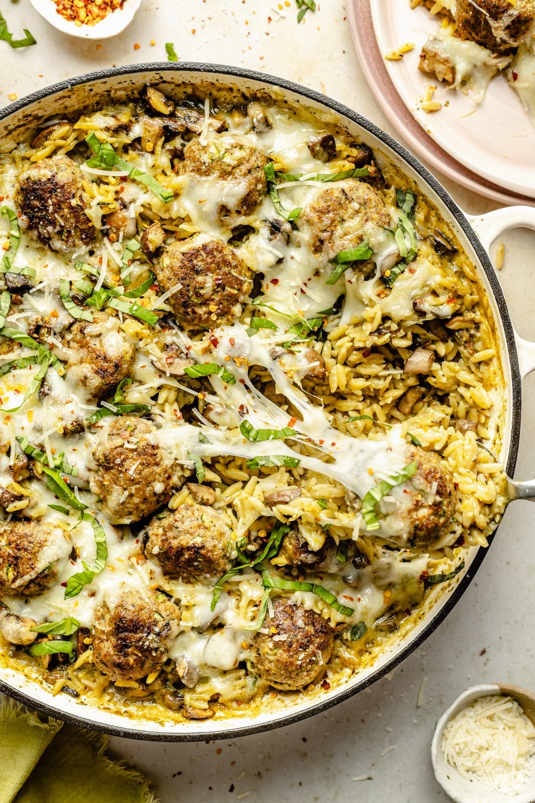 chicken meatball pesto orzo in a skillet