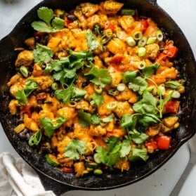 healthy sazon skillet chicken in a cast iron skillet