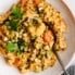 Moroccan chicken stew in a bowl with a spoon