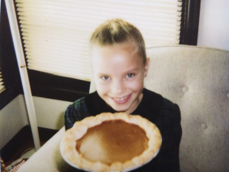 monique holding a pumpkin pie