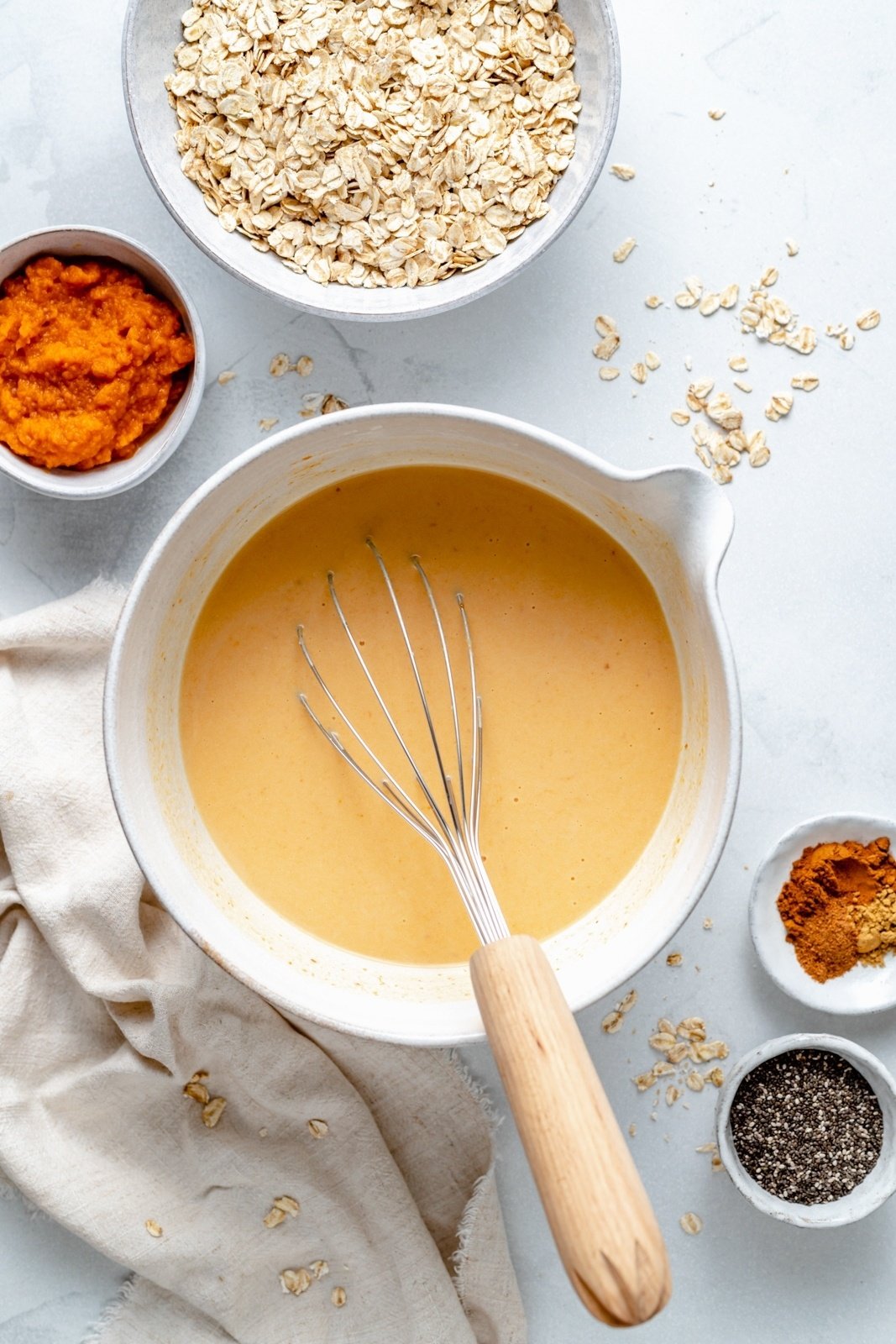 whisking wet ingredients to make pumpkin overnight oats