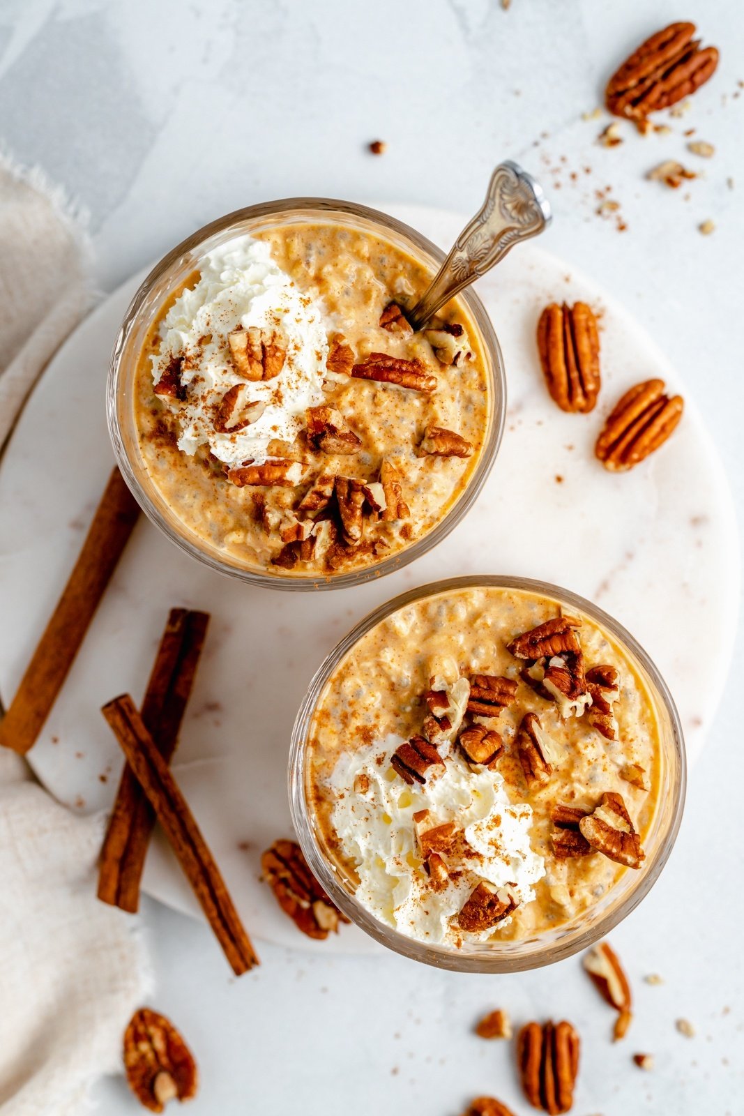 top-down view of pumpkin overnight oats in two jars