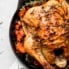 roasted chicken with carrots in a skillet