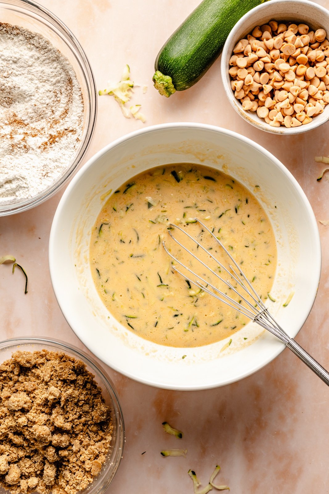 wet ingredients for a zucchini coffee cake mixed in a bowl