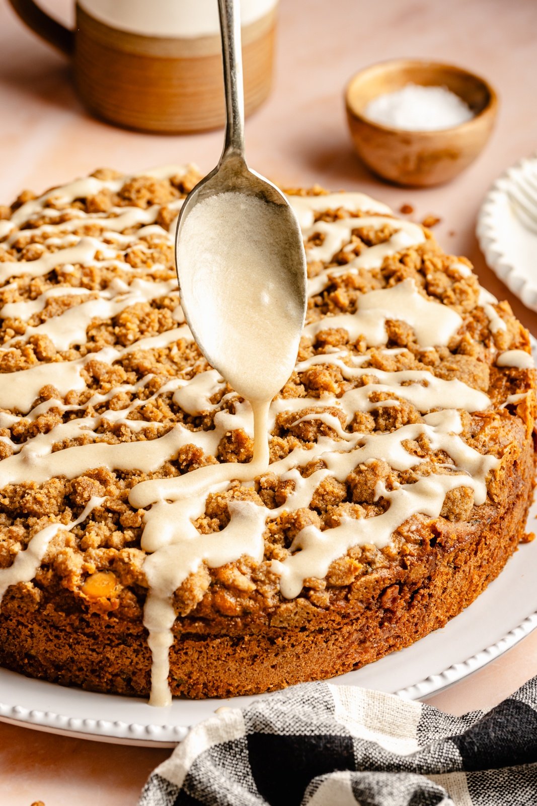 drizzling a butterscotch zucchini coffee cake with brown butter glaze