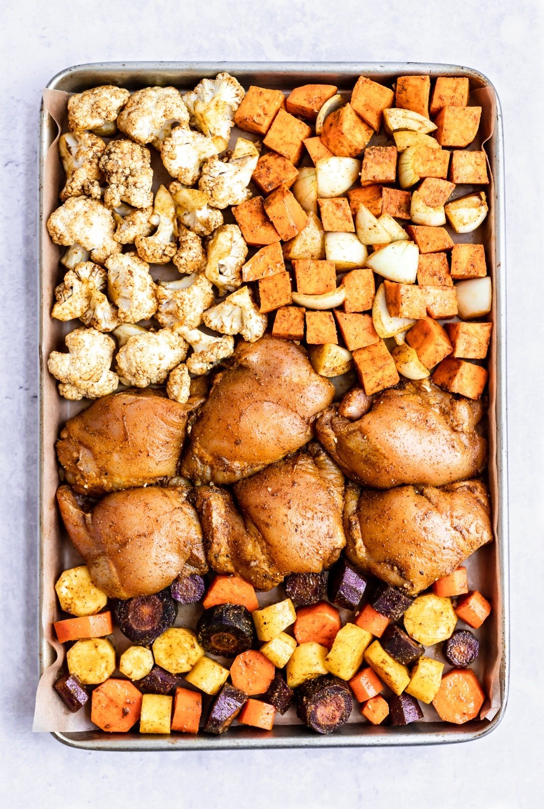 sheet pan moroccan chicken and veggies on a pan