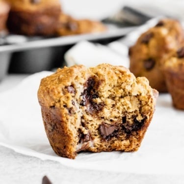 Healthy banana chocolate chip muffins with a bite taken out