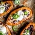 stuffed sweet potato skins on a baking sheet