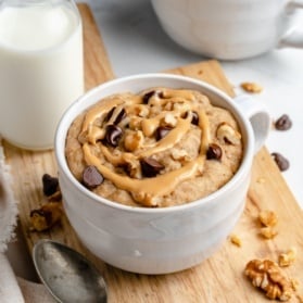 vegan banana mug cake on a wooden board