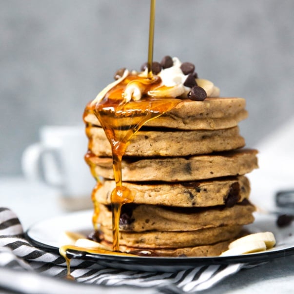 banana bread pancakes being drizzled with syrup