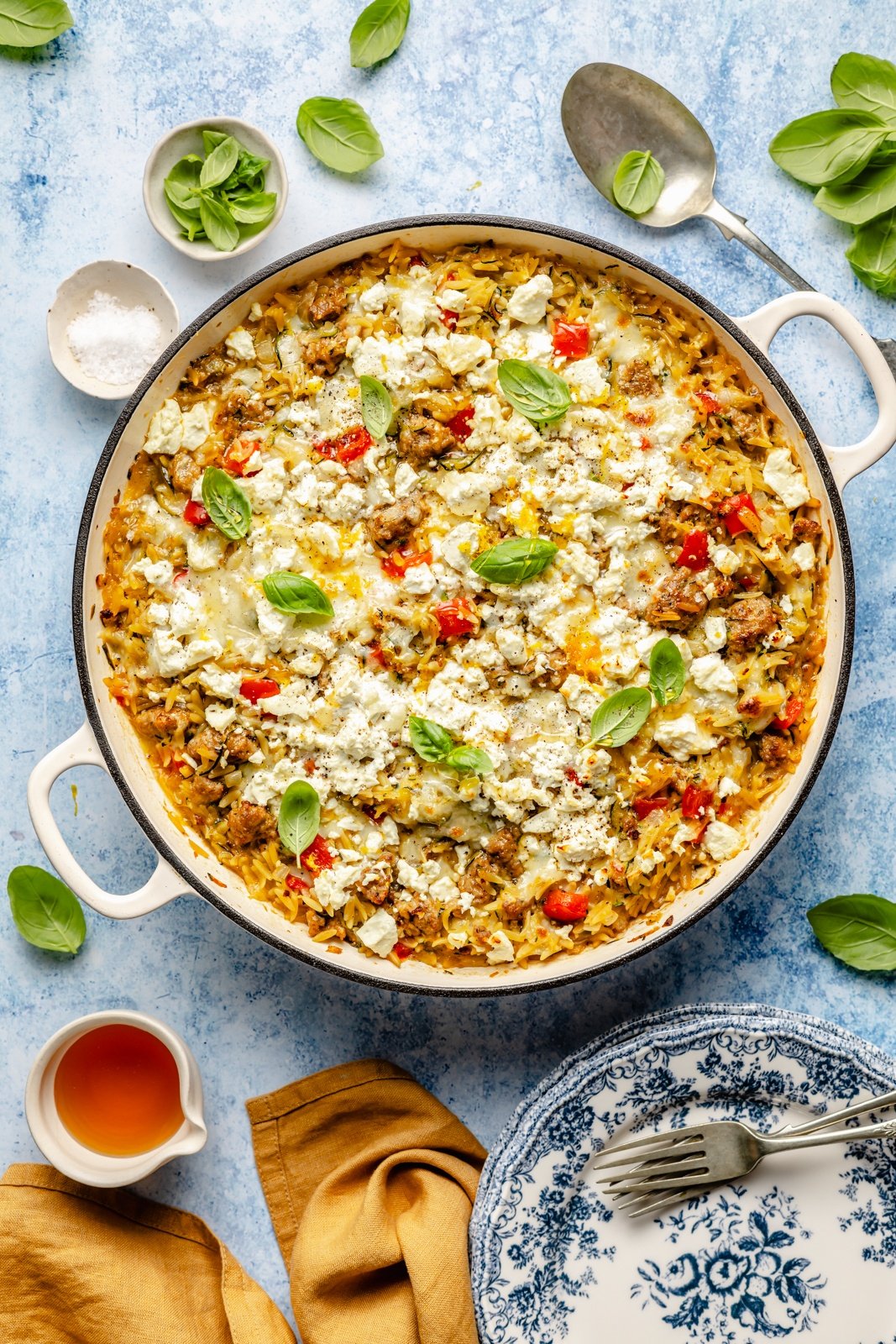 sausage zucchini baked orzo in a skillet