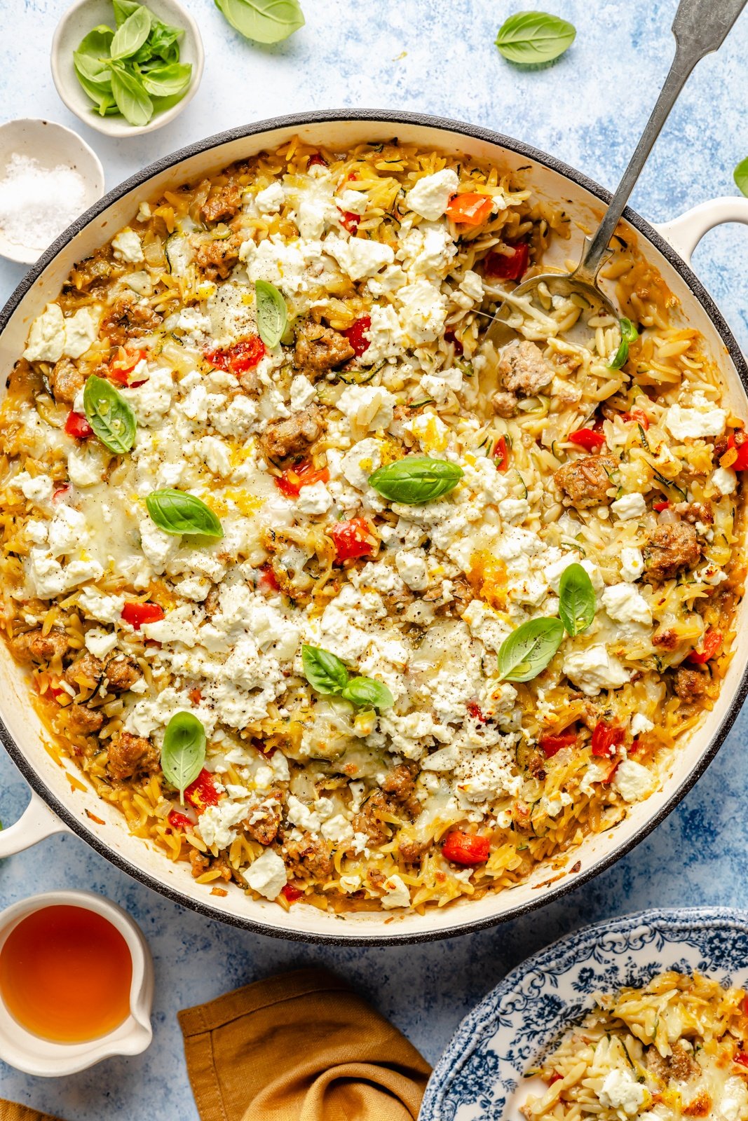 zucchini sausage baked orzo in a skillet