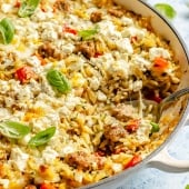 zucchini sausage baked orzo in a skillet