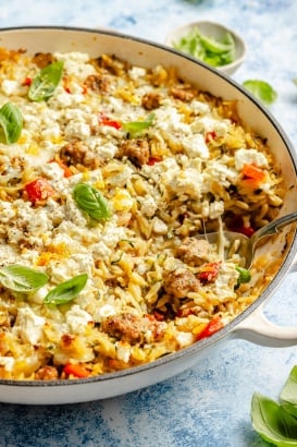 zucchini sausage baked orzo in a skillet