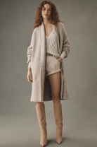 woman in a long cardigan sweater